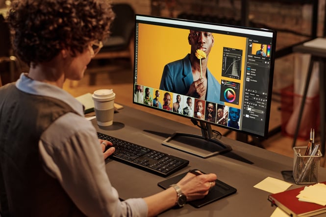 person editing photo on computer screen