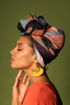young-woman-wearing-orange-dress-with-turban-ethnic-jewelry